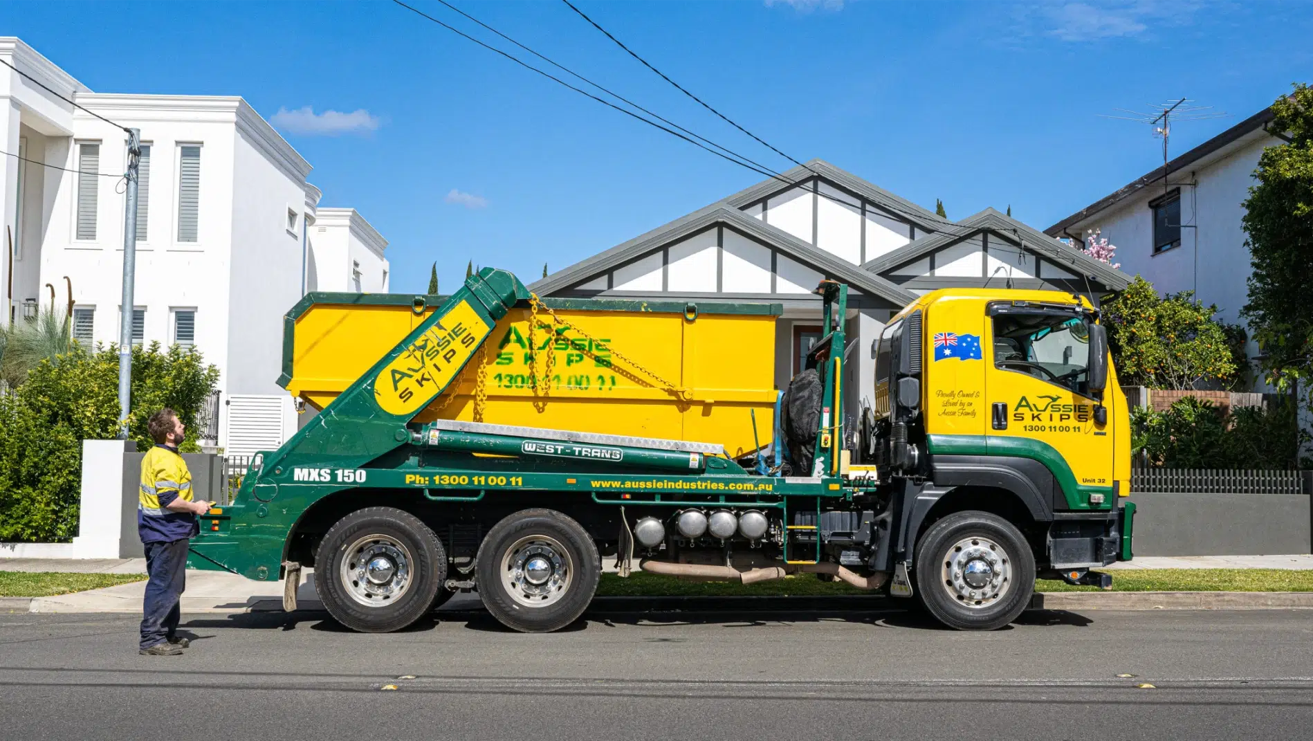 Aussie Skips truck working in a built-up Sydney area