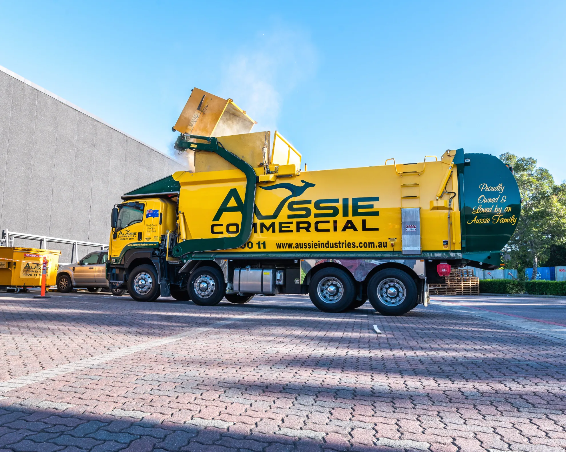 Aussie Industries Commercial skip bin getting dumped